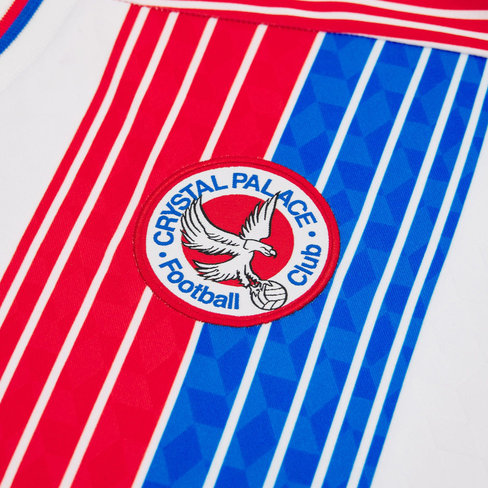 Maillot domicile rouge et bleu Macron de Crystal Palace 2026/27 à manches longues